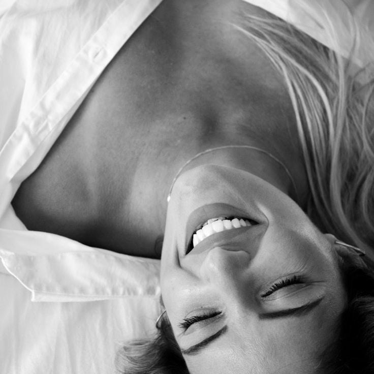 Aria Solis, Lead Design Curator at StudioGoldenShift, reviewing corporate floral arrangements